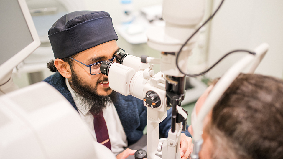 Habeeb is performing an eye test in a consulting room