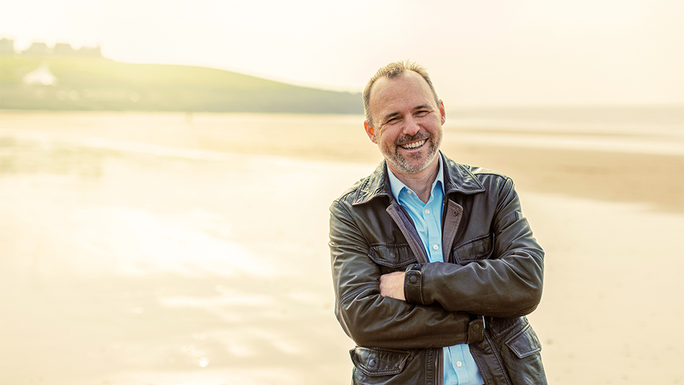 Dr Adrian Jones is photographed on Barry Island beach