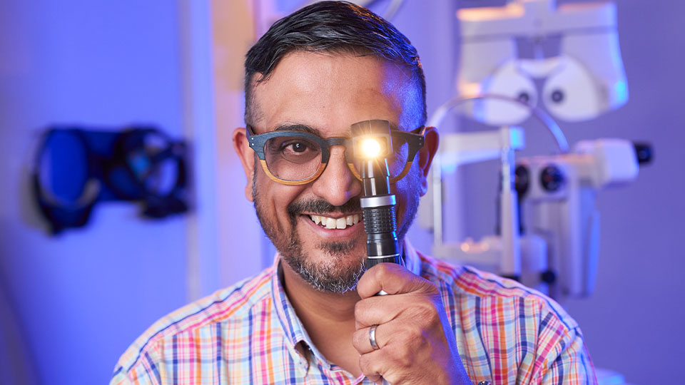 Ankur Trivedi, IP optometrist, using an ophthalmoscope