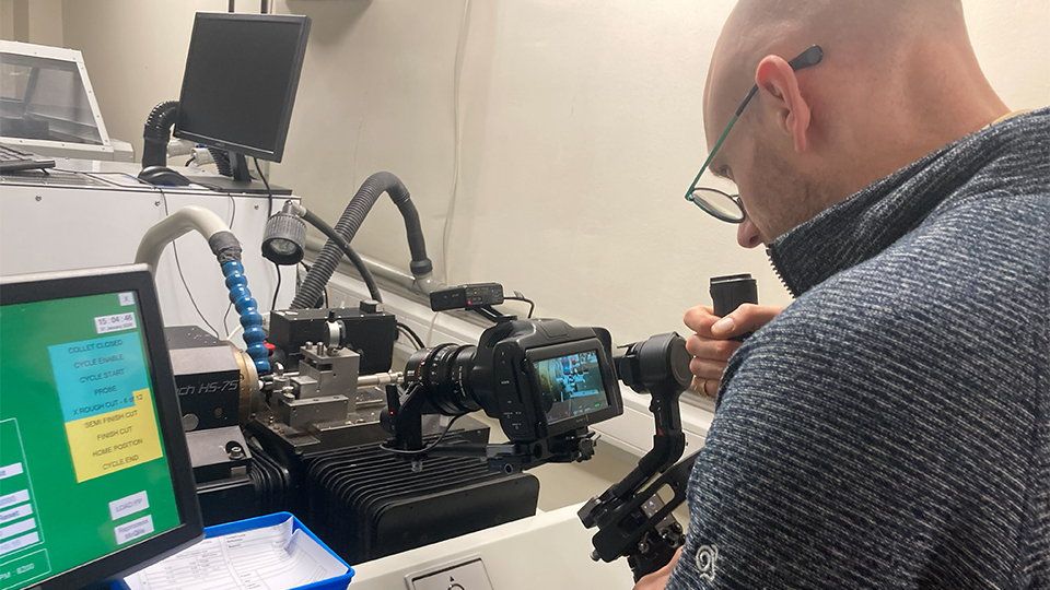 Laurence Derbyshire holding a camera filming