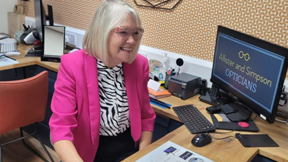 Locum dispensing optician, Jill Umpleby, carries out a blood pressure reading in practice