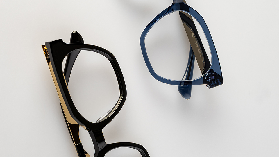 A black and gold frame and a blue-grey frame are each arranged to be half in the shot
