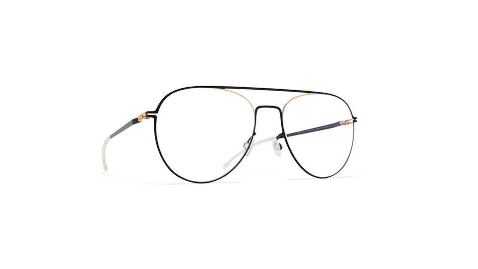A pair of black frames designed in a thin wire material. The aviators are a combination of black and gold with a cut-out on the hinges