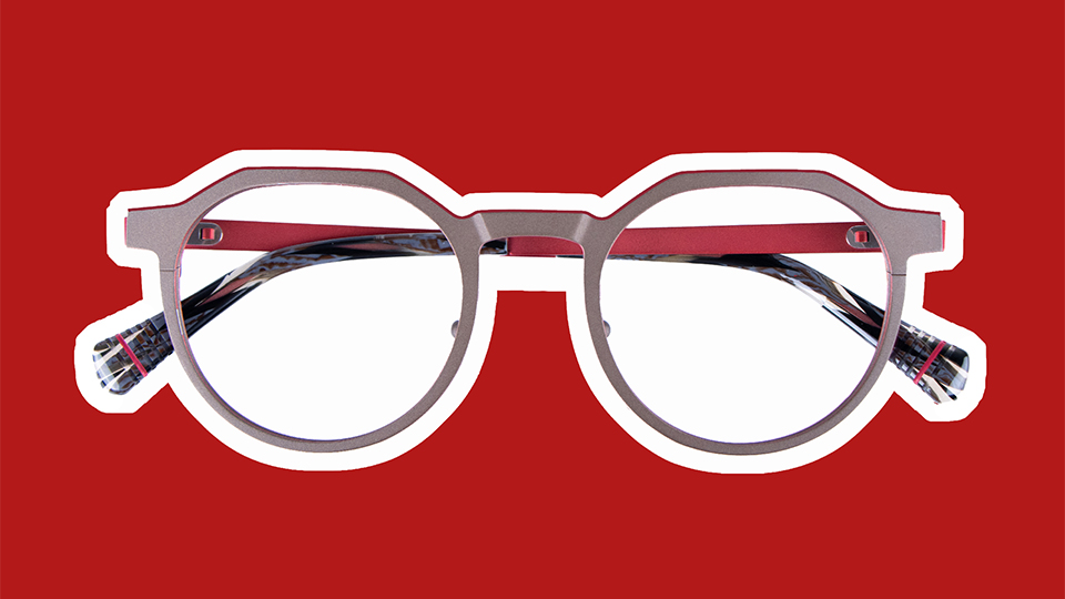 A silver metal frame overlaid on a red metal, is cut out in white against a red background