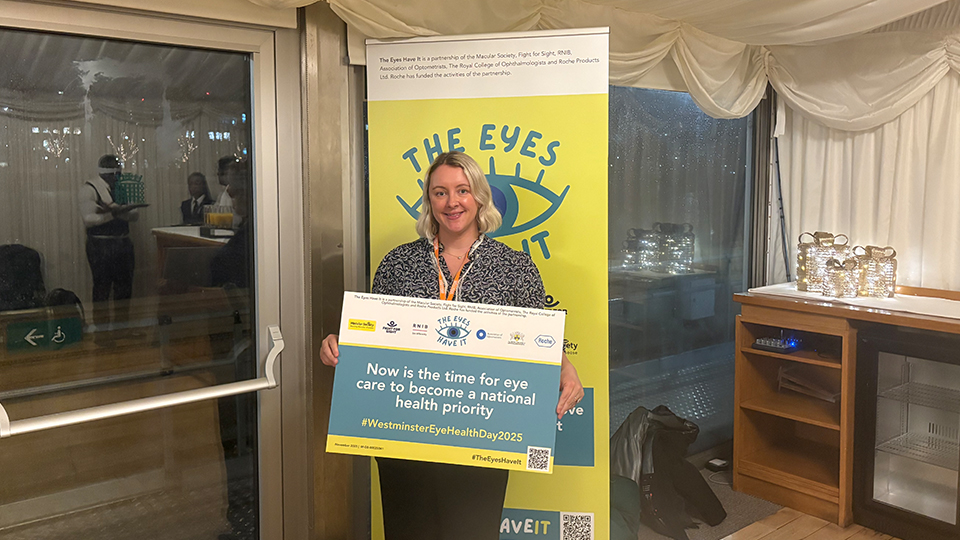 Lucy Miller at Westminster Eye health Day holding a pledge sign