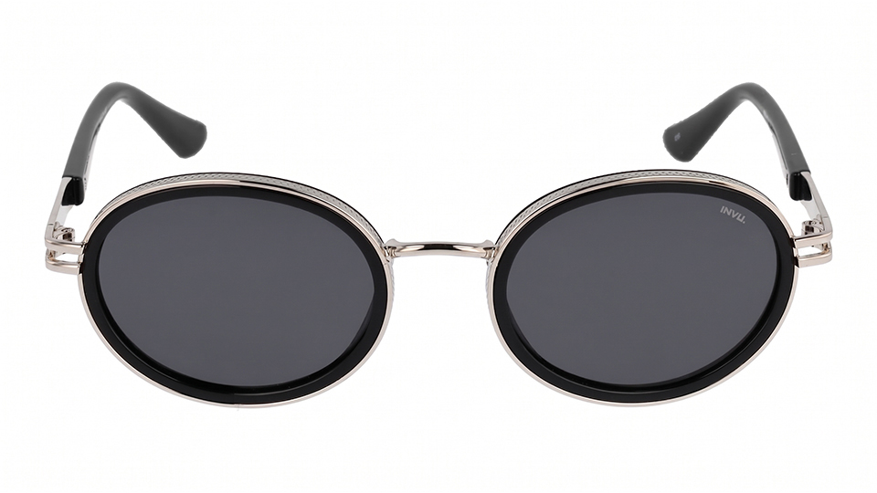 A pair of oval sunglasses with dark lenses and metal rims