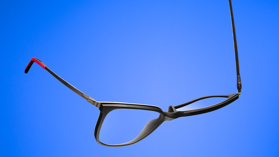 A pair of titanium frames twisted with one arm pointing up and the other down