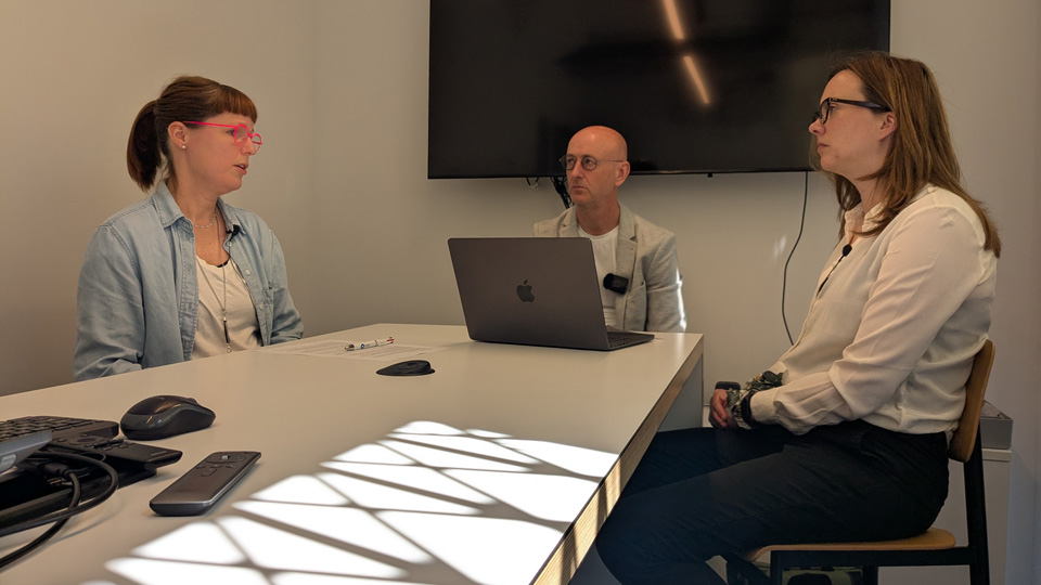 Dr Byki Huntjens, Dr Ian Beasley and Ceri Smith-Jaynes sitting around a table