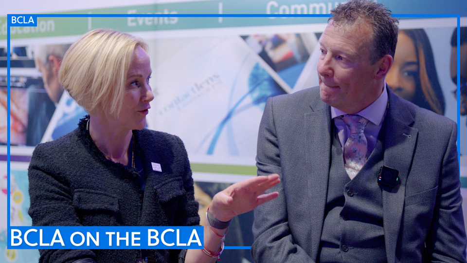 Sarah Farrant, left, and Brad Parkes, right, in conversation on the BCLA stand. A blue border is edited around them with a text box reading: BCLA on the BCLA