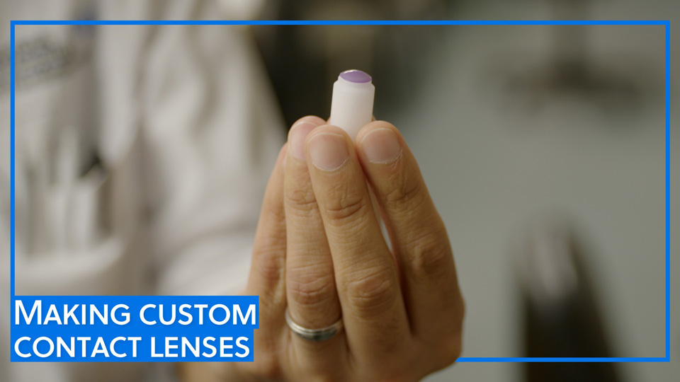 Moorfields Eye Hospital head of contact lens manufacturing, Shanil Patel, holds a contact lens