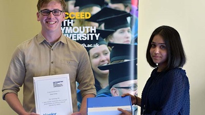 Plymouth University student Zeno Ivory collects his prize from Keeler