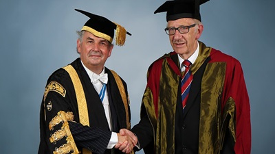 Richard Roberts (right) with UWTSD's vice chancellor Medwin Hughes (left)