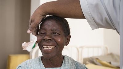 Woman receives eye care treatment
