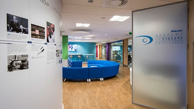 Clinic waiting room with Alcon banner