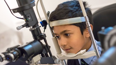 Young boy having sight test
