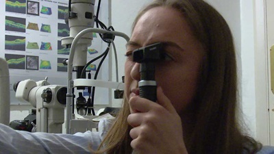 Josie Evans performing a sight test close up