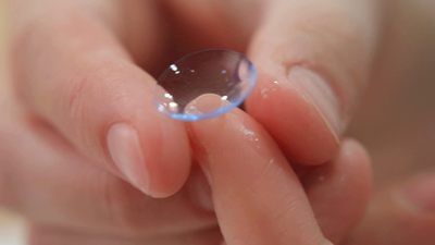 contact lens on two fingers