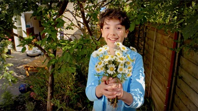 Boy with daisies
