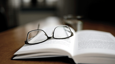 glasses on open book 
