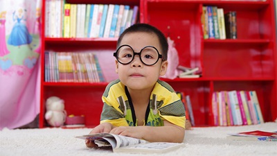A small child wearing spectacles