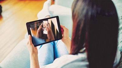 A women using the My Vision Profile app on a tablet device