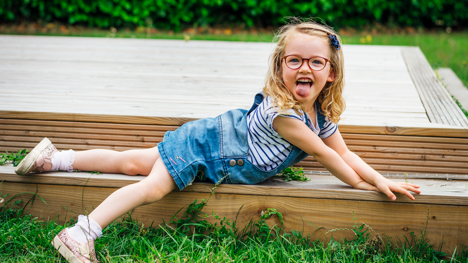 Little girl playing in the garden