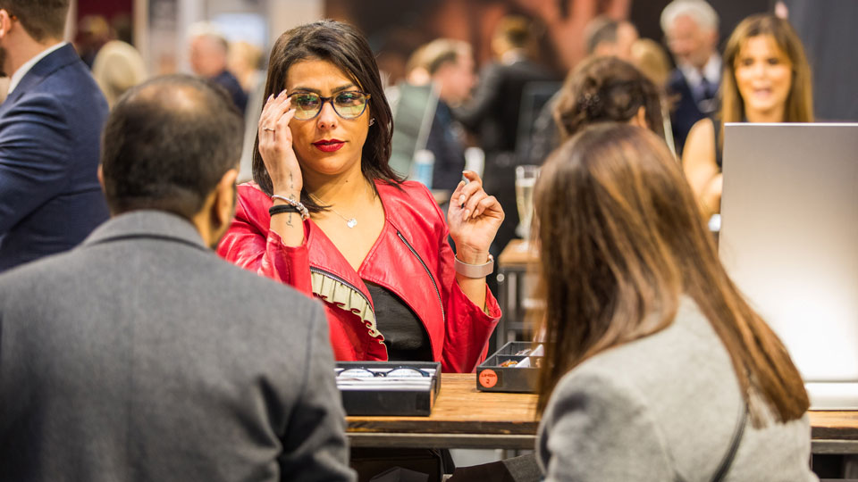 woman trying on glasses