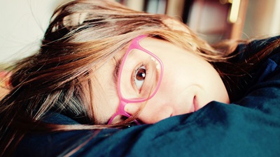 girl wearing pink glasses