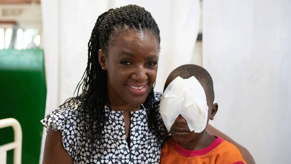 Diane Louise with child with bandage