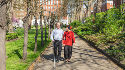 visually impaired person with woman