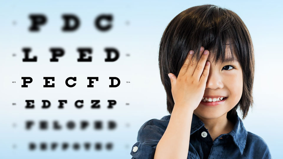 boy covering eye