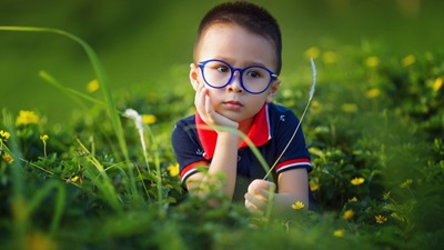 boy with blue glasses