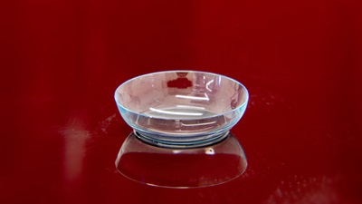 contact lens on red background