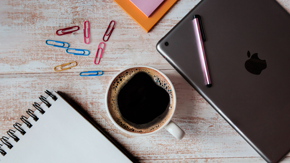 coffee, paperclips and laptop