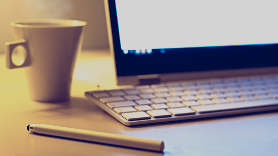 laptop cup and pen