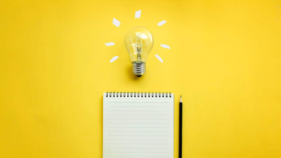 lightbulb and notepad