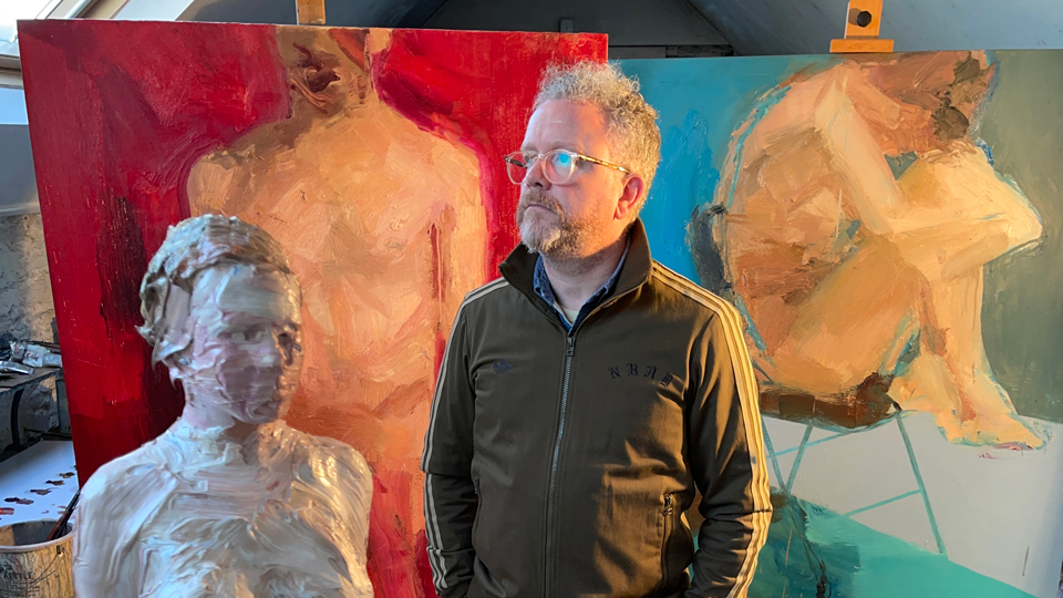 Colin with paintings
