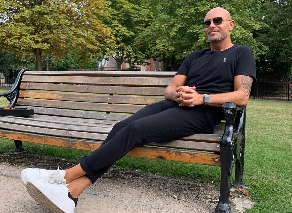 James sitting on a bench