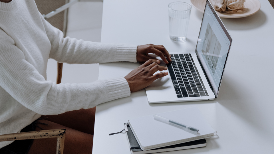 woman typing on laptop