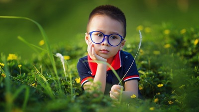 boy with blue glasses