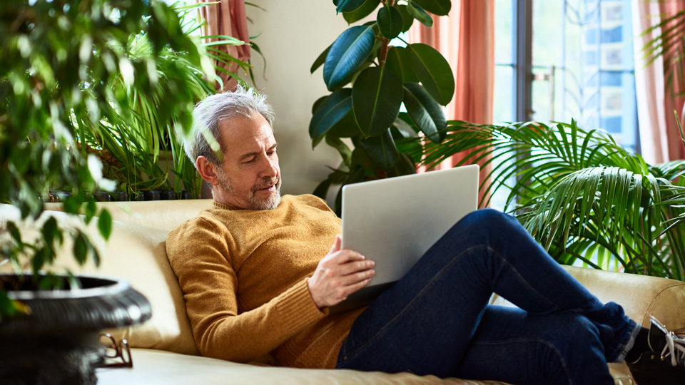 man sitting on sofa