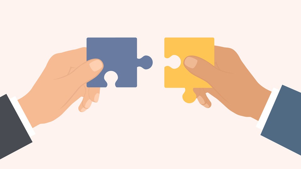 One hand on the left and the other on the right. Both hands are holding a puzzle piece. 