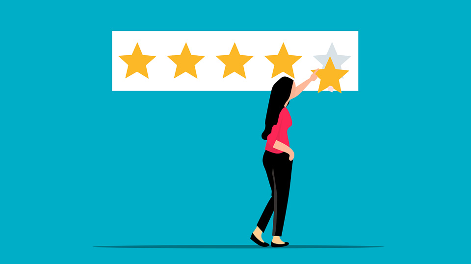 Person adding fifth yellow star to a board on the wall