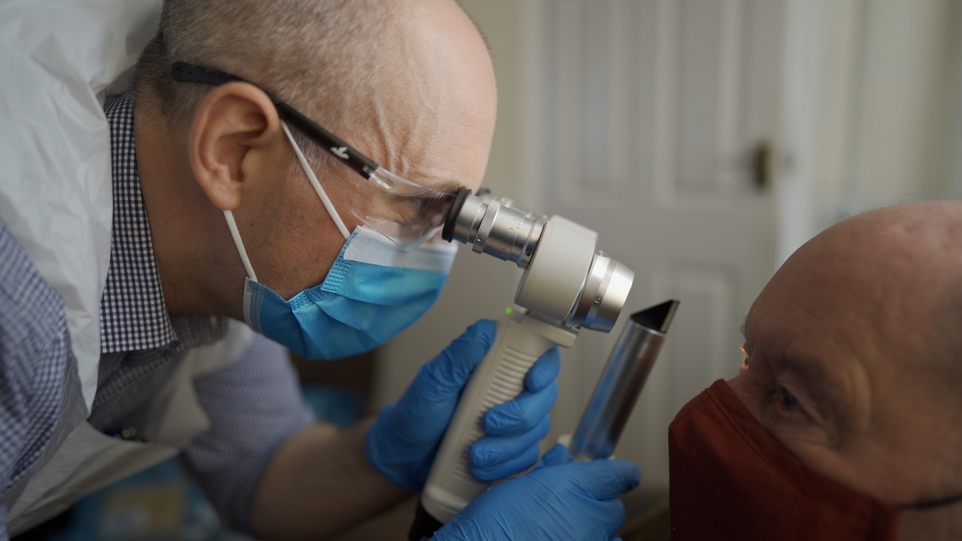 Simon is performing a domiciliary sight test on a patient
