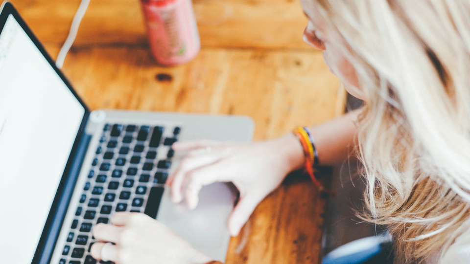 blond woman typing