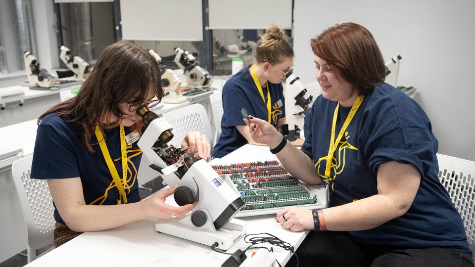 Students use the new ophthalmic dispensing equipment