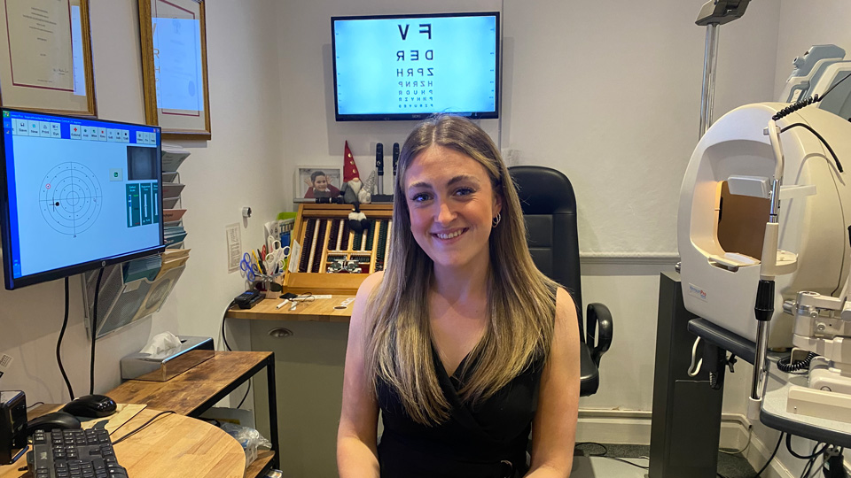 Kelly smiles in a consultation room in practice 