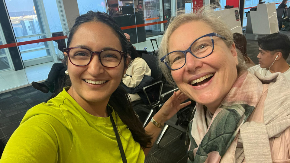 Ananya Baxi and Lynne Allard waiting to board the direct flight from Perth to London 
