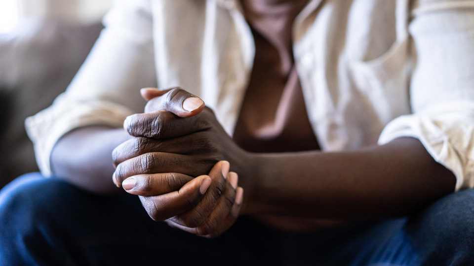 Close up of a pair of hands clasped together