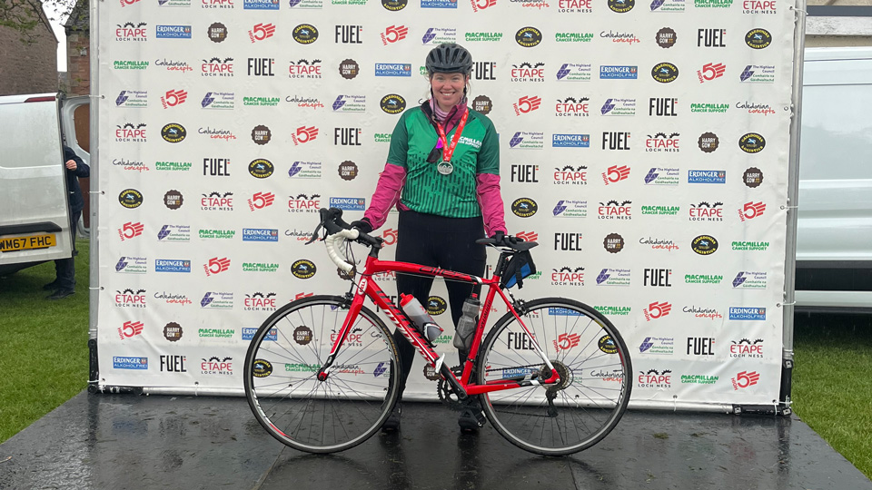 woman standing in front of her bike